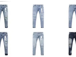 Due jeans chiari fotografati distesi su fondo bianco